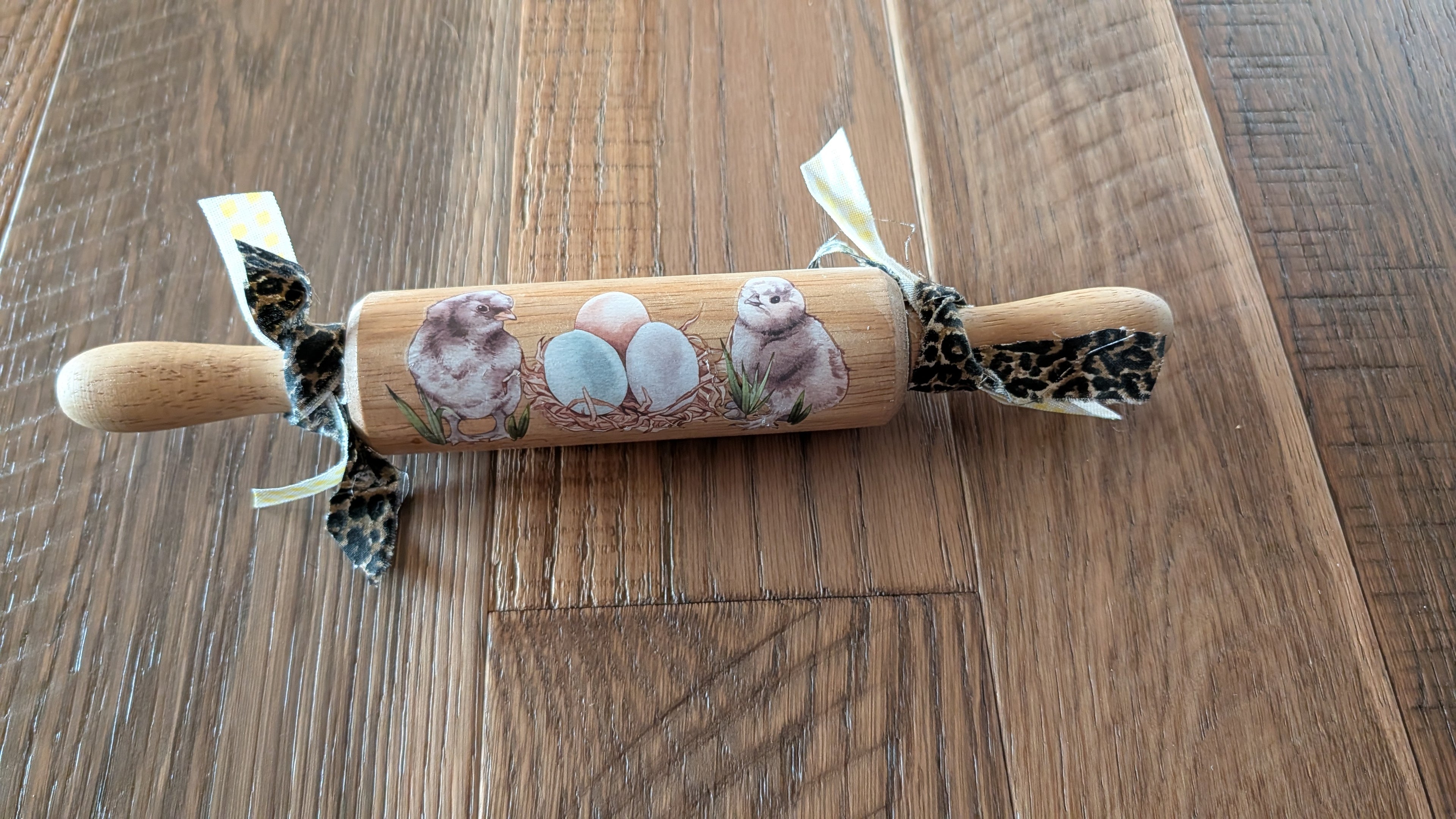 Silkie chickens on a rolling pin