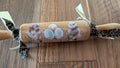 Silkie chickens on a rolling pin